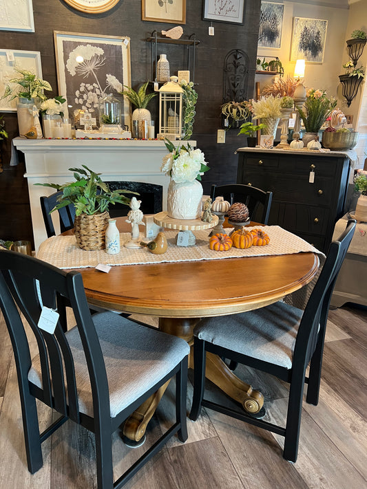 Table and 4 chairs. -47 inches round. 2 10 inch leaves.