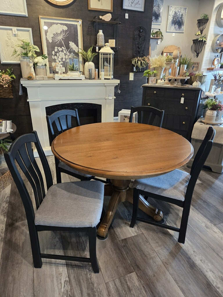Table and 4 chairs. -47 inches round. 2 10 inch leaves.