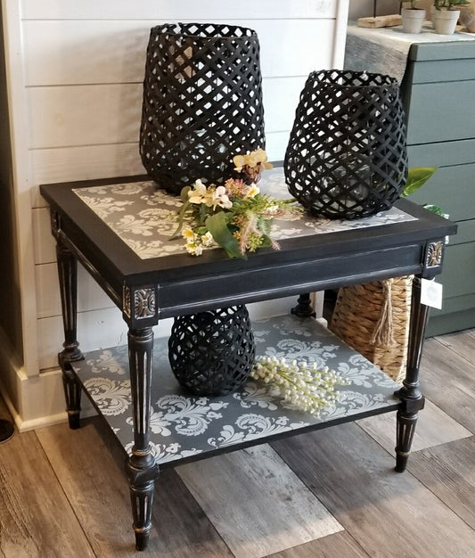 Coffee table with silver damask wallpaper